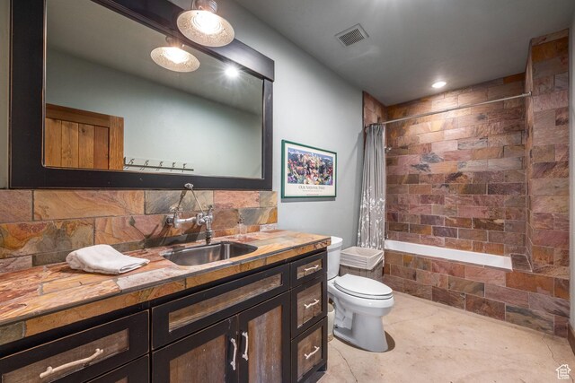 5956 N Triple Crown Trl, Oakley, UT 84055 - bathroom featuring toilet, vanity, backsplash, visible vents, and tiled shower / bath