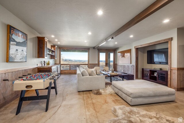 5956 N Triple Crown Trl, Oakley, UT 84055 - living area with a wainscoted wall, beam ceiling, wood walls, and recessed lighting