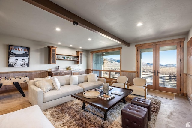 5956 N Triple Crown Trl, Oakley, UT 84055 - living room with recessed lighting, french doors, a wainscoted wall, beam ceiling, and indoor wet bar