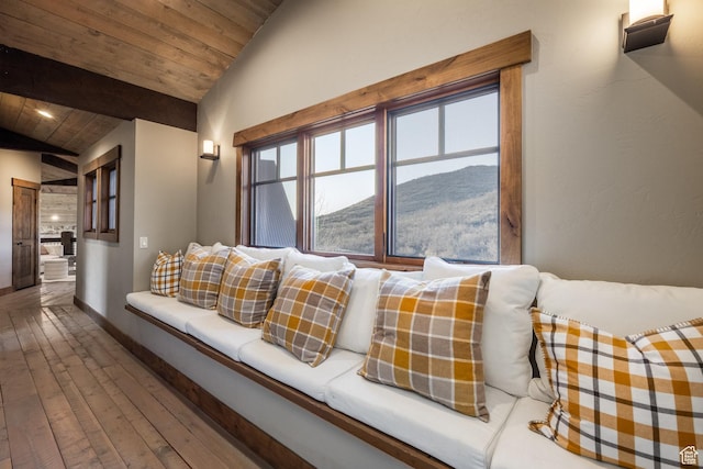 5956 N Triple Crown Trl, Oakley, UT 84055 - living area featuring baseboards, lofted ceiling, hardwood / wood-style floors, a mountain view, and wooden ceiling