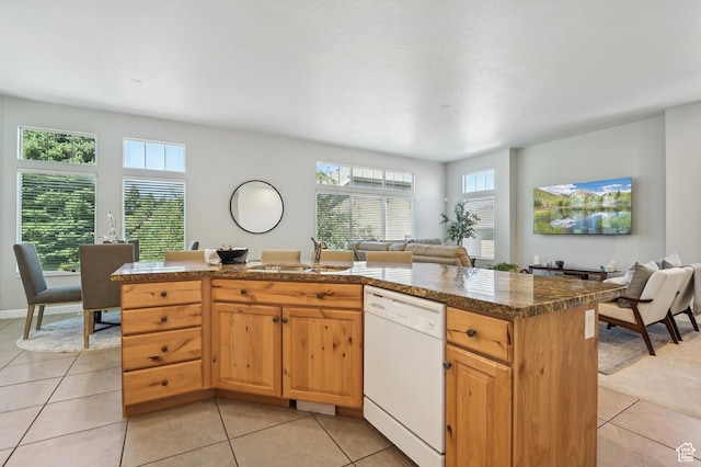 14146 S Spyglass Hill Dr, Draper, UT 84020 - kitchen featuring dishwasher, open floor plan, light tile patterned floors, and a center island with sink