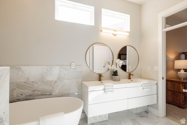 14146 S Spyglass Hill Dr, Draper, UT 84020 - bathroom featuring a freestanding tub, double vanity, and marble finish flooring