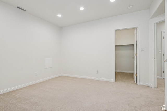 14146 S Spyglass Hill Dr, Draper, UT 84020 - unfurnished bedroom with light carpet, a spacious closet, and recessed lighting