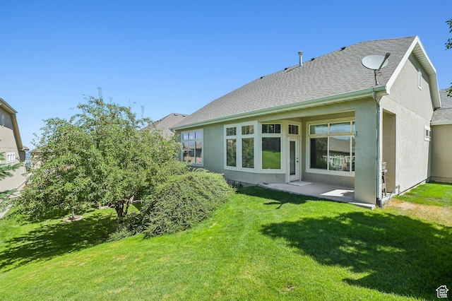 14146 S Spyglass Hill Dr, Draper, UT 84020 - back of property featuring stucco siding, a lawn, and roof with shingles