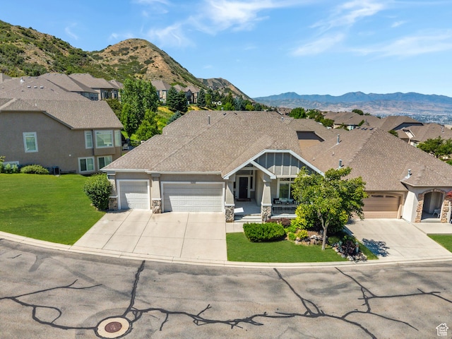 14146 S Spyglass Hill Dr, Draper, UT 84020 - craftsman inspired home featuring concrete driveway, an attached garage, a front yard, and a residential view