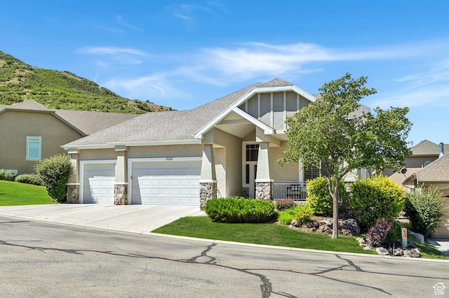 14146 S Spyglass Hill Dr, Draper, UT 84020 - craftsman house with stone siding, an attached garage, concrete driveway, and stucco siding