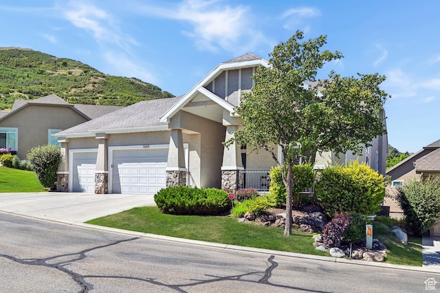 14146 S Spyglass Hill Dr, Draper, UT 84020 - craftsman-style home with stone siding, stucco siding, a garage, driveway, and roof with shingles
