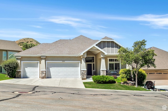 14146 S Spyglass Hill Dr, Draper, UT 84020 - craftsman-style house with stone siding, concrete driveway, stucco siding, an attached garage, and a shingled roof