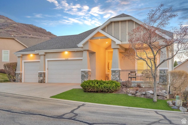 14146 S Spyglass Hill Dr, Draper, UT 84020 - view of front of property with stone siding, an attached garage, driveway, and stucco siding