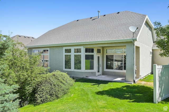 14146 S Spyglass Hill Dr, Draper, UT 84020 - back of property with stucco siding, a lawn, and a shingled roof