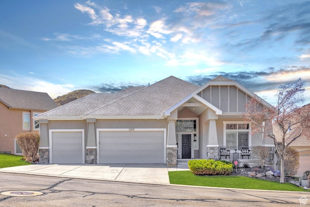 14146 S Spyglass Hill Dr, Draper, UT 84020 - craftsman-style home featuring an attached garage, stone siding, driveway, and stucco siding