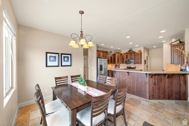 1041 E Silver Shadows Dr, Washington, UT 84780 - dining space featuring baseboards, a chandelier, recessed lighting, and stone tile floors