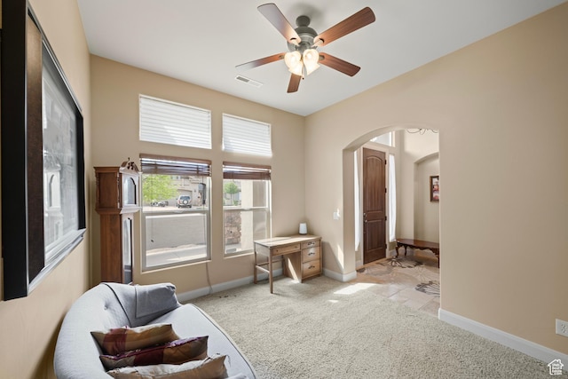 1041 E Silver Shadows Dr, Washington, UT 84780 - living area featuring baseboards, visible vents, arched walkways, and carpet flooring