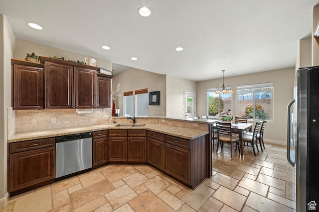 1041 E Silver Shadows Dr, Washington, UT 84780 - kitchen featuring recessed lighting, a sink, a peninsula, stone tile flooring, and appliances with stainless steel finishes
