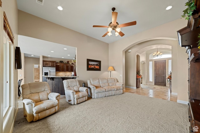 1041 E Silver Shadows Dr, Washington, UT 84780 - living room with arched walkways, ceiling fan, recessed lighting, and light carpet