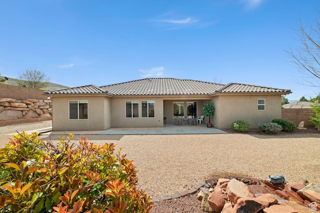 1041 E Silver Shadows Dr, Washington, UT 84780 - rear view of property with a tiled roof, stucco siding, and a patio area
