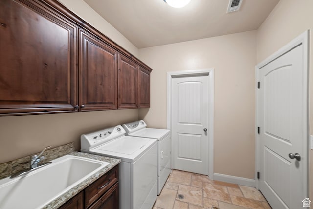 1041 E Silver Shadows Dr, Washington, UT 84780 - laundry room with stone tile floors, independent washer and dryer, a sink, visible vents, and cabinet space