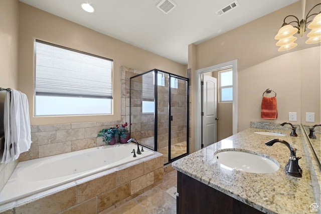 1041 E Silver Shadows Dr, Washington, UT 84780 - full bath with a jetted tub, visible vents, and a sink