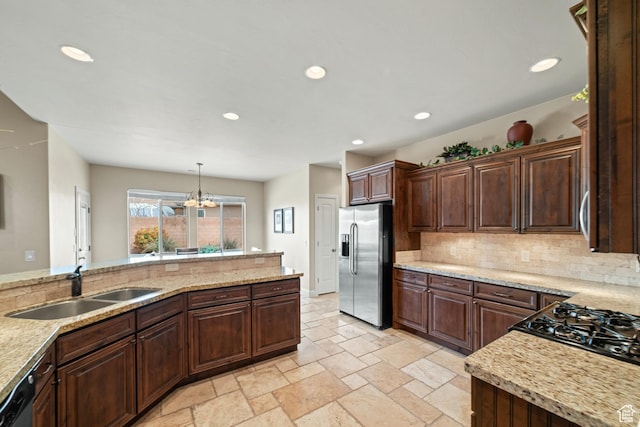1041 E Silver Shadows Dr, Washington, UT 84780 - kitchen featuring stainless steel fridge, recessed lighting, tasteful backsplash, a sink, and stone tile floors