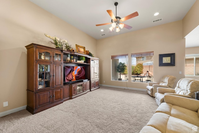 1041 E Silver Shadows Dr, Washington, UT 84780 - living room featuring light carpet, baseboards, ceiling fan, and visible vents