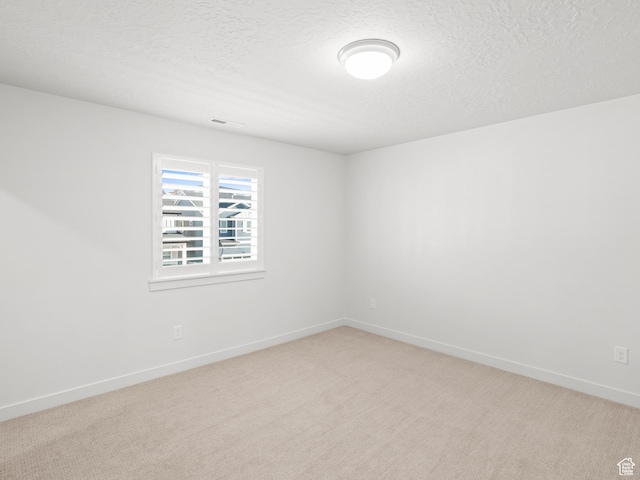 963 W Ruddy Clover Ln Unit 282, Saratoga Springs, UT 84045 - unfurnished room featuring visible vents, baseboards, light colored carpet, and a textured ceiling
