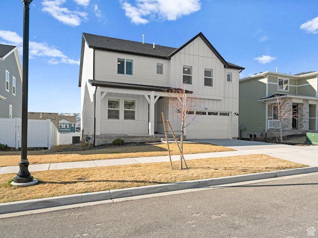 963 W Ruddy Clover Ln Unit 282, Saratoga Springs, UT 84045 - modern farmhouse with a garage, board and batten siding, concrete driveway, and fence