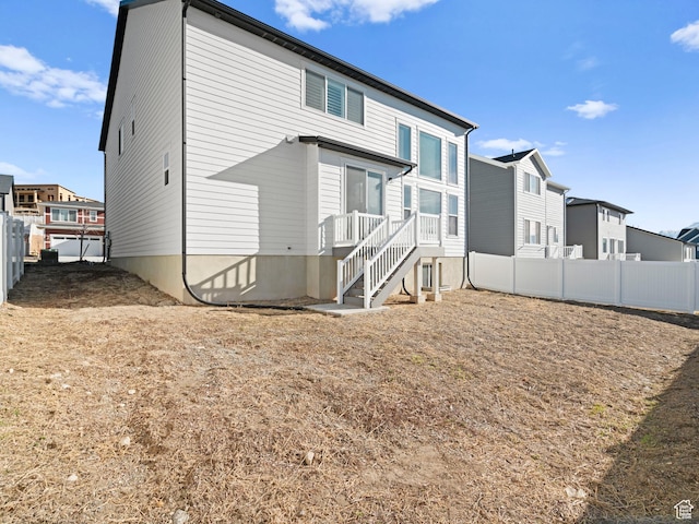 963 W Ruddy Clover Ln Unit 282, Saratoga Springs, UT 84045 - back of house with a fenced backyard and a residential view