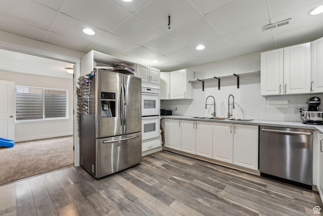4 E Sterling Loop, Vineyard, UT 84059 - kitchen featuring visible vents, stainless steel appliances, white cabinetry, a sink, and open shelves