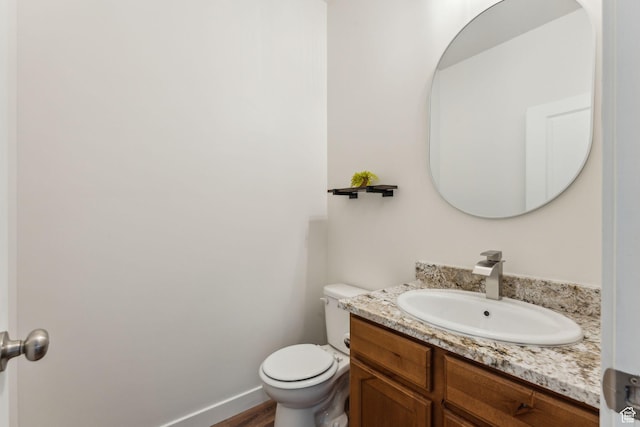 4 E Sterling Loop, Vineyard, UT 84059 - bathroom with baseboards, wood finished floors, toilet, and vanity