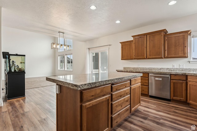 4 E Sterling Loop, Vineyard, UT 84059 - kitchen with dark wood finished floors, brown cabinetry, dishwasher, and a textured ceiling