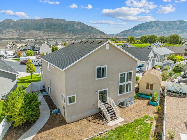 4 E Sterling Loop, Vineyard, UT 84059 - back of house with a residential view, fence, stucco siding, and a mountain view