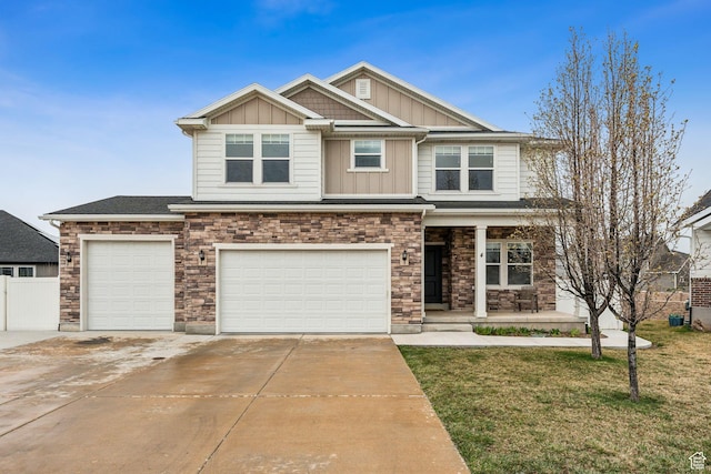 craftsman inspired home featuring stone siding, fence, concrete driveway, board and batten siding, and a porch