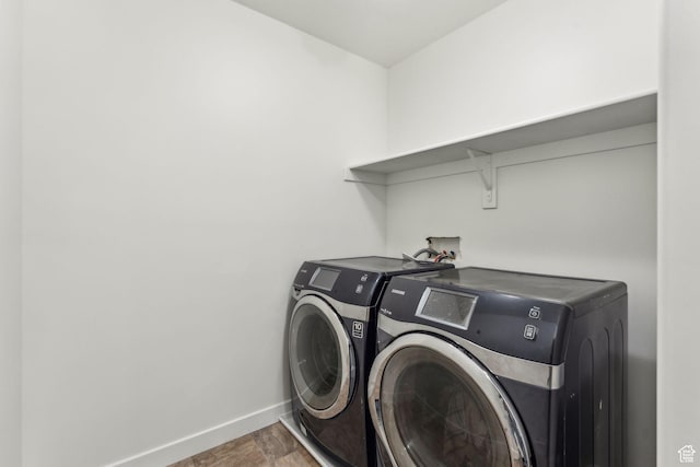 4 E Sterling Loop, Vineyard, UT 84059 - laundry room with baseboards, wood finished floors, laundry area, and washer and clothes dryer