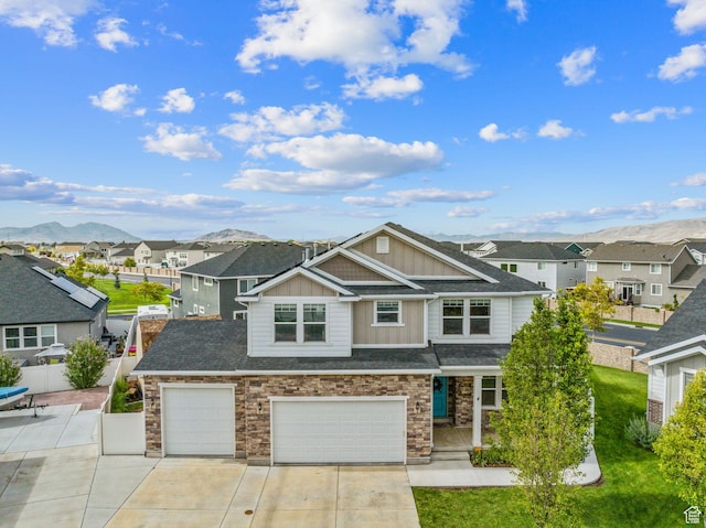 4 E Sterling Loop, Vineyard, UT 84059 - view of front of home featuring concrete driveway, stone siding, board and batten siding, a residential view, and a garage