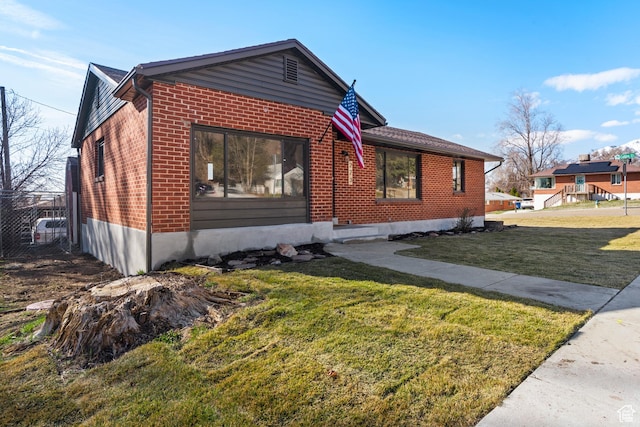 223 N Harrison Blvd, Ogden, UT 84404 - view of front of property featuring brick siding and a front yard