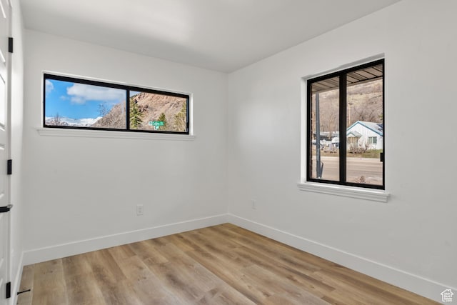 223 N Harrison Blvd, Ogden, UT 84404 - unfurnished room with light wood finished floors and baseboards