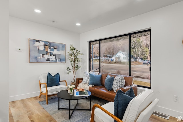 223 N Harrison Blvd, Ogden, UT 84404 - living room featuring baseboards, visible vents, wood finished floors, and recessed lighting