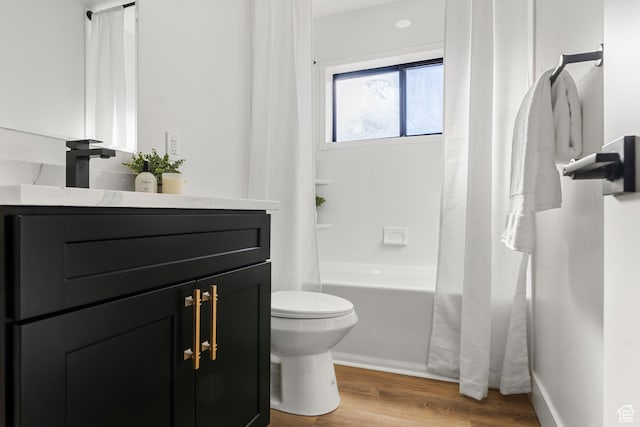 223 N Harrison Blvd, Ogden, UT 84404 - full bathroom with baseboards, wood finished floors, toilet, vanity, and shower / bath combo with shower curtain