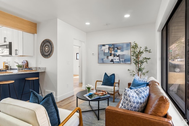 223 N Harrison Blvd, Ogden, UT 84404 - living room with baseboards, recessed lighting, and light wood-style floors