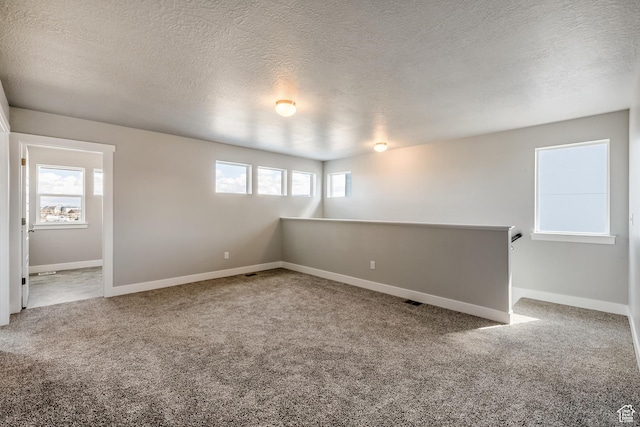 3807 W 1760 S Unit 206, Taylor, UT 84401 - basement with carpet floors, baseboards, and a textured ceiling