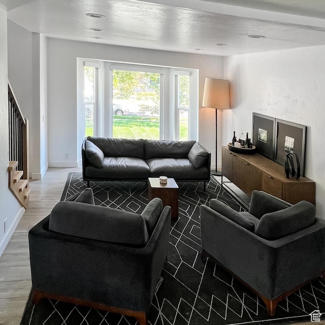 5188 S Saddleback Dr, Holladay, UT 84117 - living room with wood finished floors, stairs, and baseboards