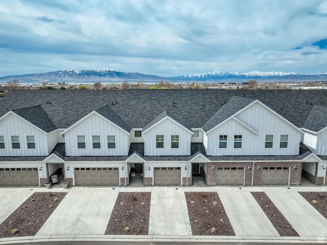 499 N 420 W Unit 138, Lindon, UT 84042 - view of front of property with driveway, a garage, board and batten siding, and roof with shingles