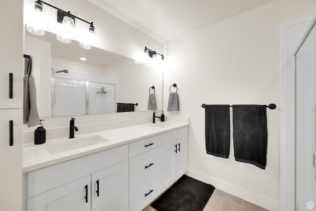 499 N 420 W Unit 138, Lindon, UT 84042 - bathroom with a shower stall, double vanity, baseboards, and a sink