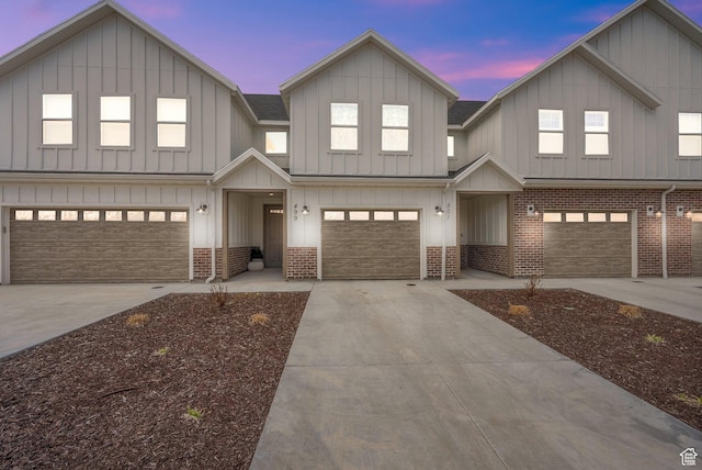 499 N 420 W Unit 138, Lindon, UT 84042 - modern farmhouse featuring brick siding, concrete driveway, and a garage