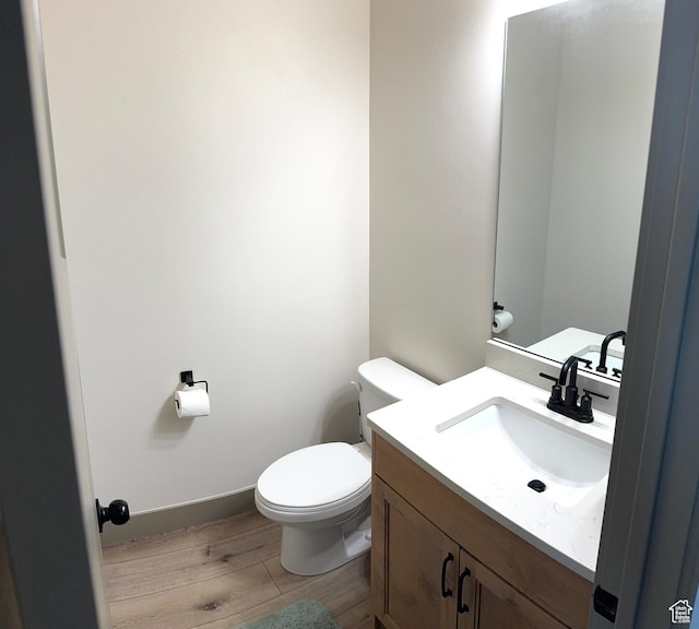 386 S Amber Field Dr Unit 508, Grantsville, UT 84029 - bathroom featuring baseboards, wood finished floors, toilet, and vanity