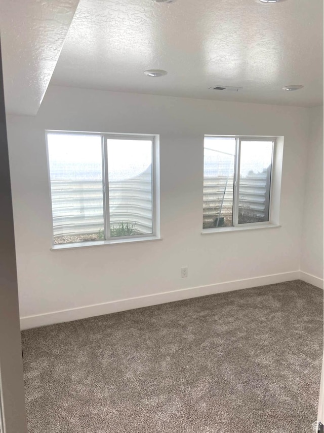 386 S Amber Field Dr Unit 508, Grantsville, UT 84029 - empty room featuring carpet floors, baseboards, and a textured ceiling
