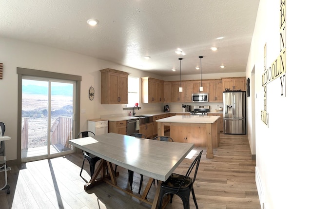 386 S Amber Field Dr Unit 508, Grantsville, UT 84029 - dining area with a textured ceiling, recessed lighting, a healthy amount of sunlight, and light wood-style floors