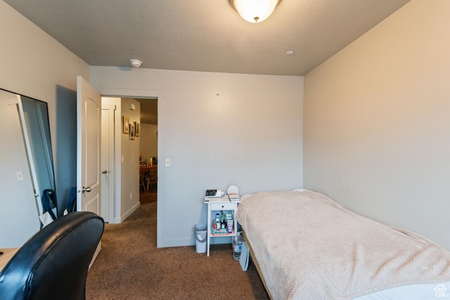 carpeted bedroom with baseboards