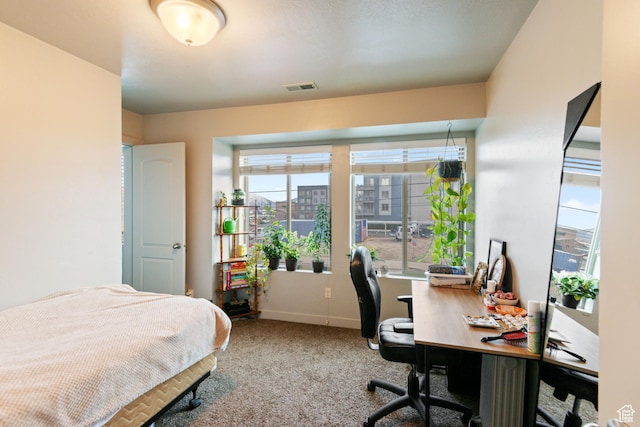 bedroom with baseboards, carpet flooring, and visible vents