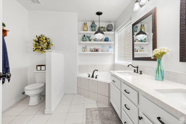 bathroom featuring double vanity, toilet, a sink, a garden tub, and tile patterned flooring
